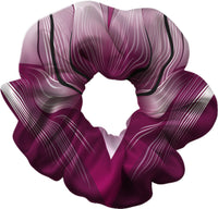Purple scrunchie with black and white striped pattern on a white background