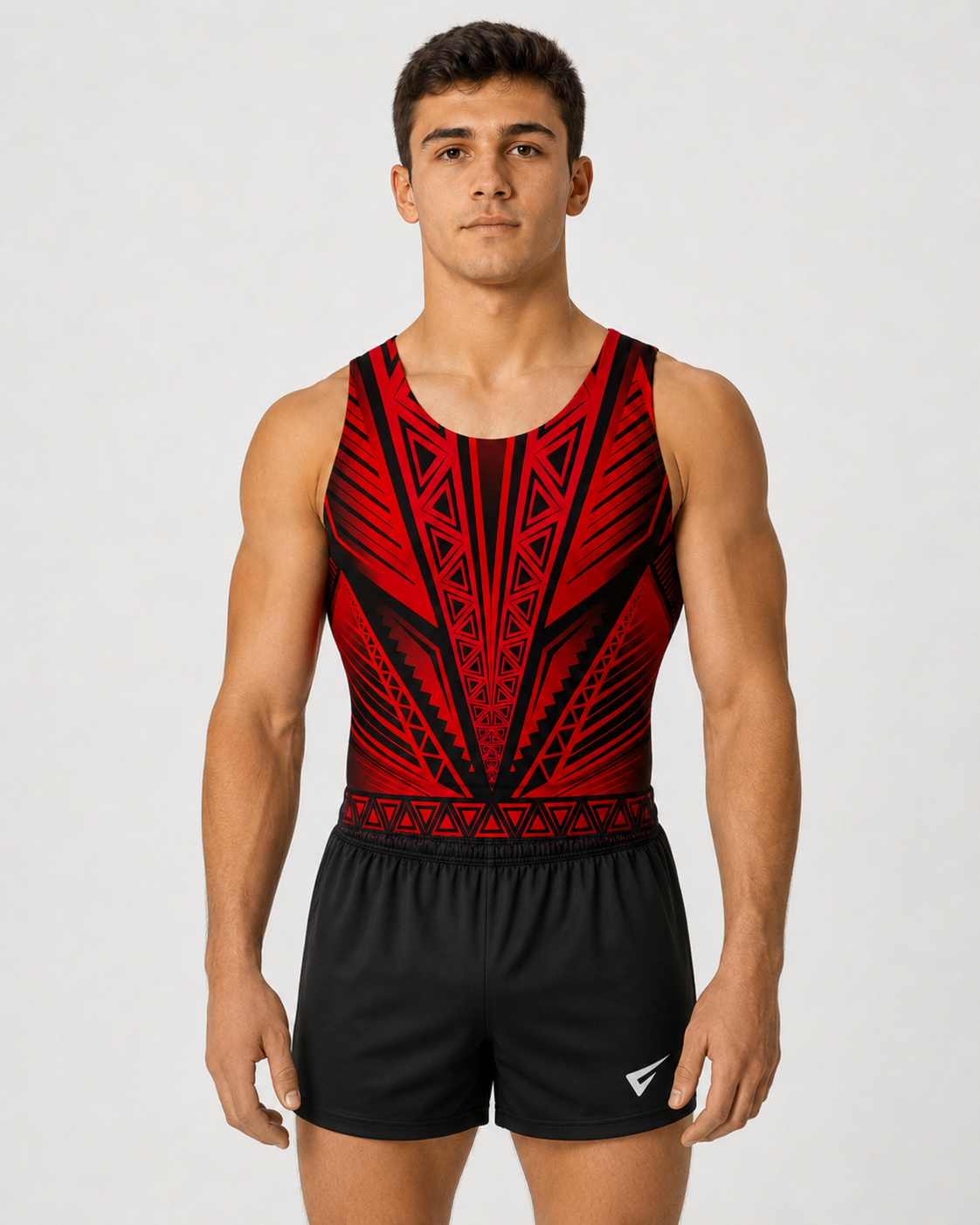 Young male gymnast wearing the Dynamite Isla red sleeveless gymnastics leotard with black shorts