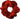 Red scrunchie with black intricate patterns on a white background