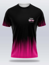 A black short-sleeve athletic t-shirt with a vibrant pink gradient dot pattern along the sleeves and hem, featuring a white 'TOPAZ Gymnastics' logo on the left chest.