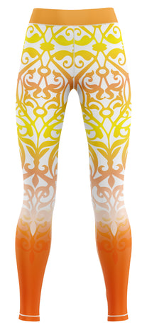 Pair of orange and yellow gym leggings on a plain background