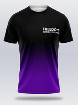 A unisex t-shirt with a black crew neck, featuring a full print design that includes the text 'FREEDOM' and 'Dance Studios' in a gradient of black, light purple, and purple colors.