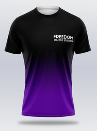 A unisex t-shirt with a black crew neck, featuring a full print design that includes the text 'FREEDOM' and 'Dance Studios' in a gradient of black, light purple, and purple colors.