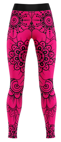 Pair of pink activewear leggings laid flat on a neutral background