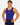 A muscular man wearing a royal blue athletic tank top with a small white logo on the chest, paired with navy blue shorts, standing against a light gray studio background.